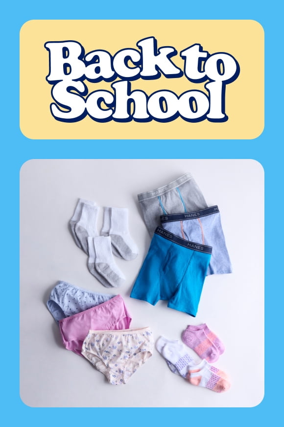 Flat lay of children's colorful boxer briefs, patterned underwear, and crew socks on white; essential everyday back-to-school kids’ basics.
