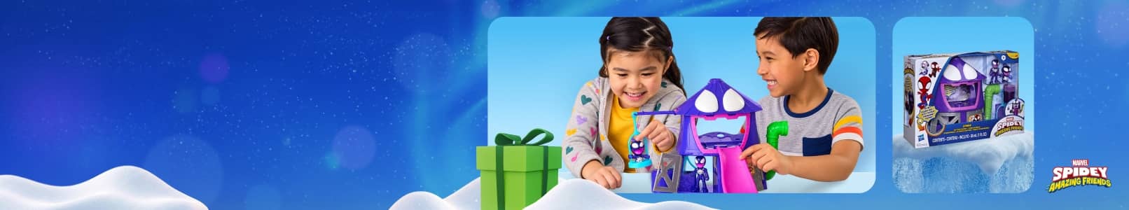 Two children play with a purple Spidey rocket toy next to a green gift box and the toy packaging.