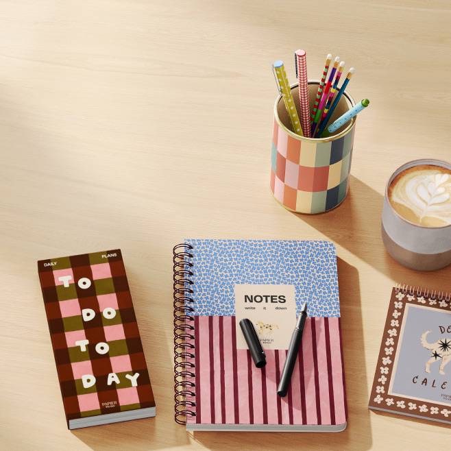 To Do Today planner, Notes notebook with pens, patterned notebook, multicolor cup of pencils and latte on a light desk.