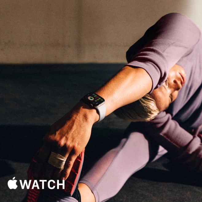 Image of a person stretching while wearing a black smartwatch. Apple Watch logo. Call, text & track. Smartwatches, smart prices. Shop now.