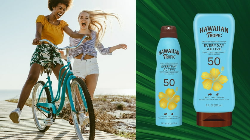 Friends on bikes laughing on a sunny day boardwalk