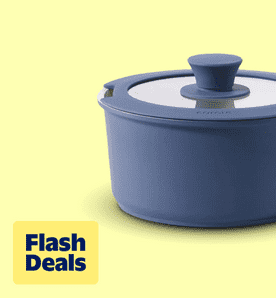 Image shows a navy blue Carote pot with a lid on a light yellow background.