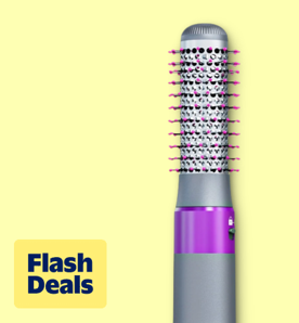Image shows a black NEXPURE hair dryer brush with pink bristles on a pale yellow background.