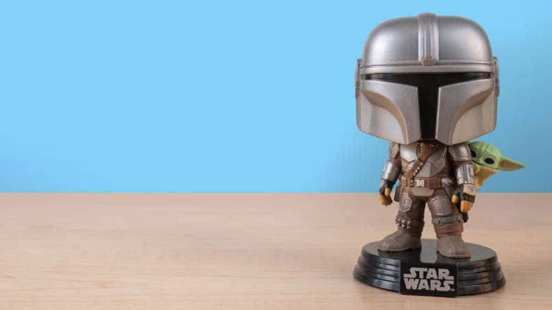 Funko Pop Star Wars Mandalorian and Grogu figures.