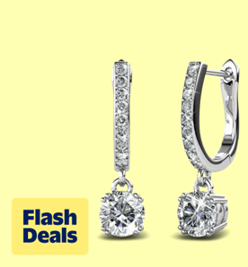 Image shows silver Cate & Chloe drop dangle earrings with Swarovski crystals on a light yellow background.