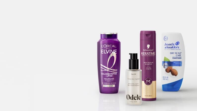 Loreal Elvive shampoo, Schwarzkopf Keratime shampoo, Odele hair product and Head and Shoulders dry scalp care conditioner bottles.