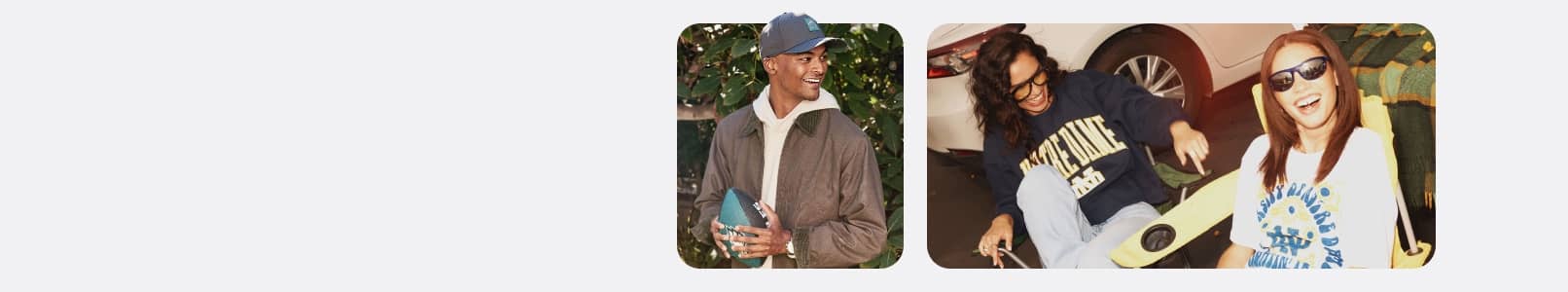 Three adults in casual game day clothing smiling and holding sports themed items outdoors.