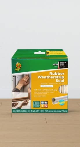 An image of Duck brand rubber weatherstrip seal on a wood table, against a white wall.