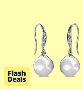 Image shows white Cate & Chloe shell pearl earrings with Swarovski crystals on a pale yellow background.