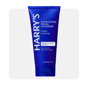 Image shows a blue tube of Harry's men's exfoliating face wash with peppermint and eucalyptus on a light gray background.
