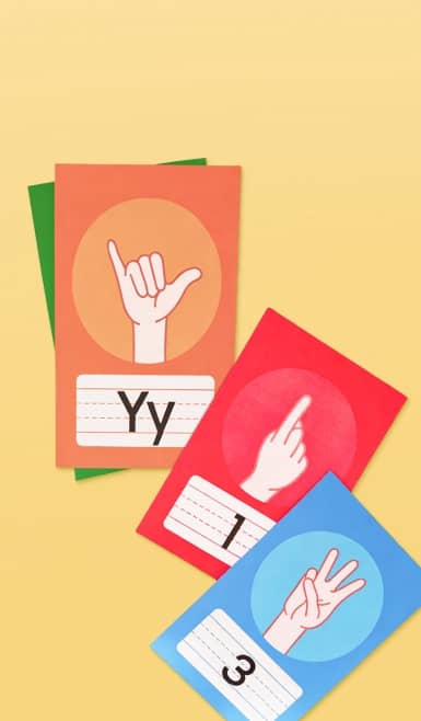 Colorful ASL flash cards on a yellow background.