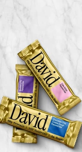 David’s protein bars in the flavors cake batter, blueberry pie and chocolate chip are shown.