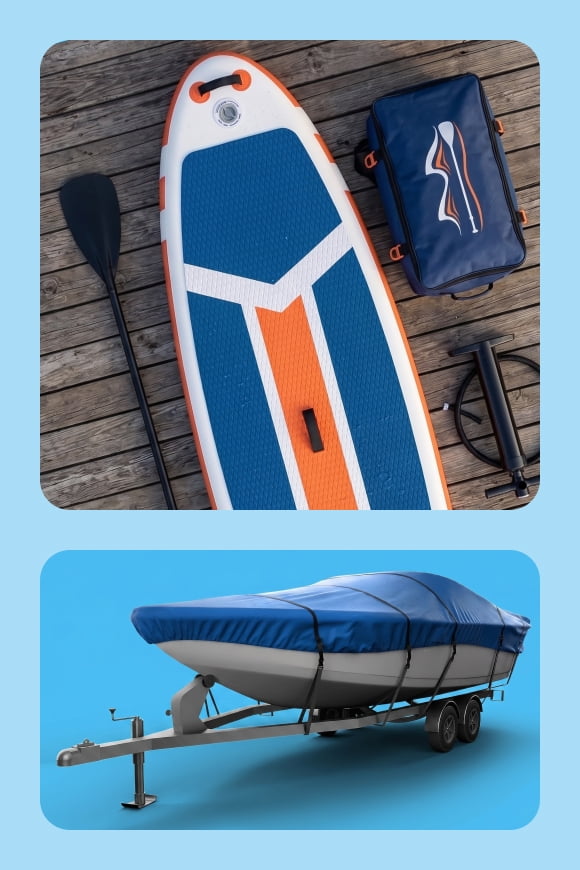 A paddle board on a dock and a covered boat.
