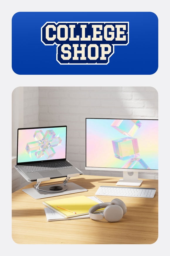 College Shop badge. A laptop on a pedestal, a large screen, a keyboard and headphones on a desk.