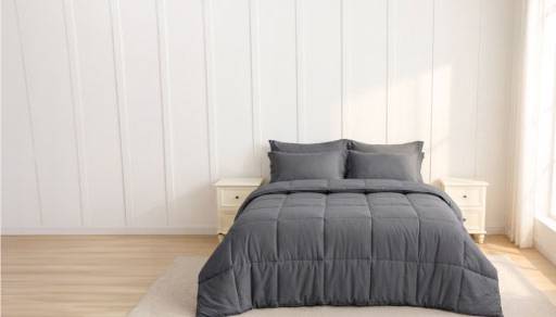 A modern bedroom with a luxe grey bedding set.