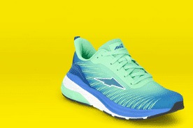 Image shows a green and blue Avia men's running shoe on a yellow background.
