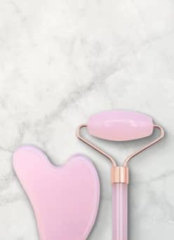 Rose quartz face roller gua sha set.