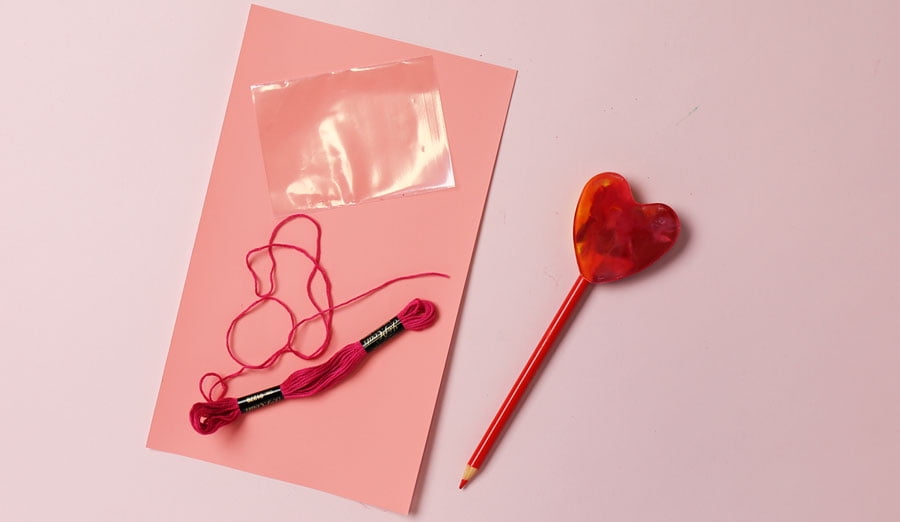 treat bag, embroidery floss and lollipop pencil