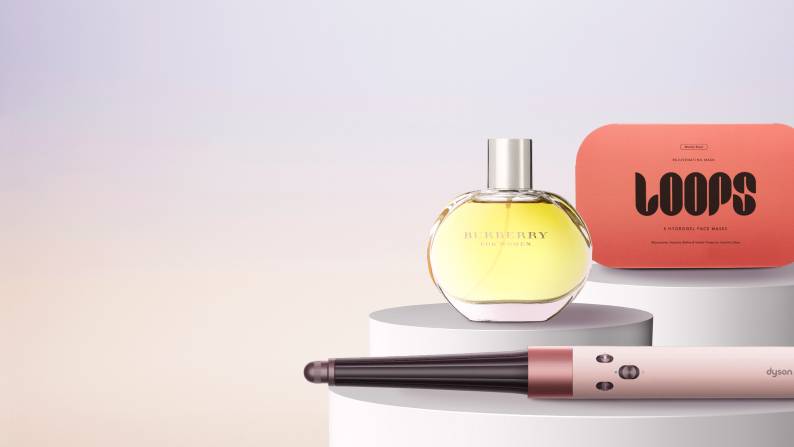 Banner with Burberry perfume, Loops face masks, and Dyson hair tool with text: “Discover beauty's best. Burberry & more premium beauty. Shop now.”