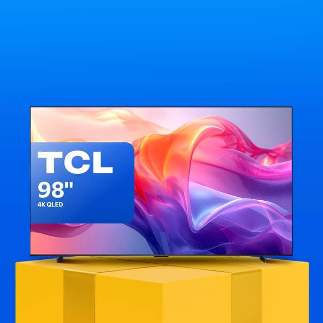 A ninety-eight-inch TCL TV is on top of a gift box podium.
