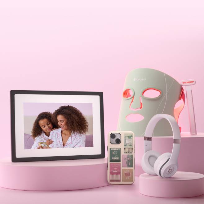 Assorted tech gifts: smart picture frame, designer iPhone case, pink Beats headphones, Nanoleaf LED therapy mask and Solawave skincare wand.
