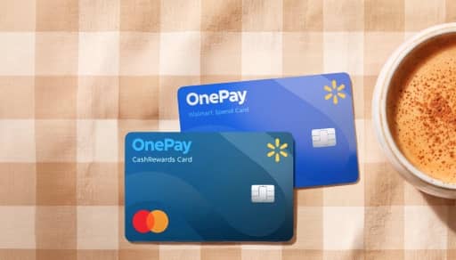 OnePay CashRewards Card and OnePay Walmart Spend Card on a checkered table beside a cup of coffee.
