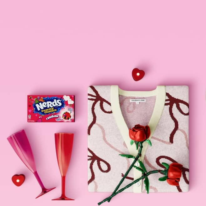 Drinking glasses, roses, sweater and fragrance.