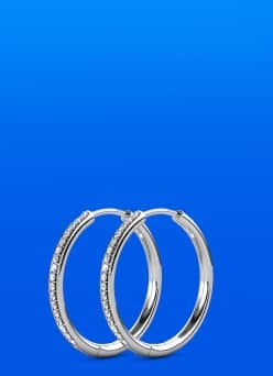 Image shows silver hoop earrings.