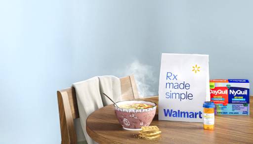 Kitchen setting, Walmart prescription bag on table next to a bowl of oatmeal and DayQuil.