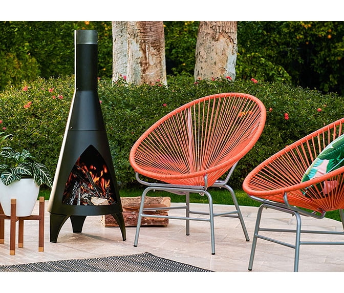 By Style Mid Century A Mid Century Modern Outdoor Setting With Red Acapulco Chairs Retro Fireplace
