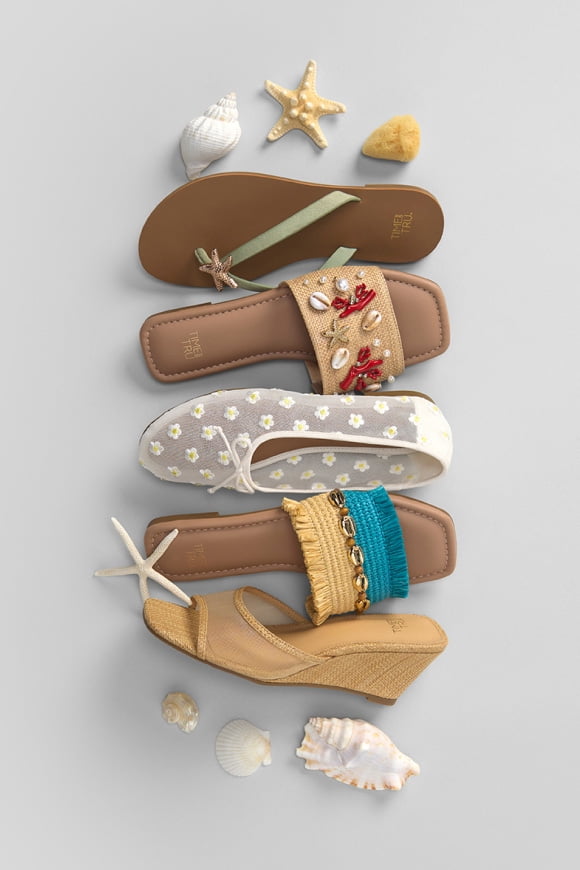 One white lace mesh ballet flat; one teal and yellow slide; one yellow wedge; one shell embellished flat; one thong sandal with star embellishment.