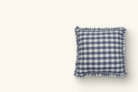 An image of a single decorative pillow with a checkered pattern.
