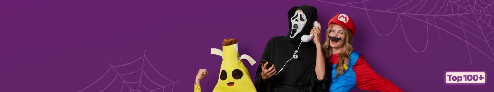 Top one hundred plus badge. Three adults in banana, masked hooded and red hat costumes pose together holding phones.