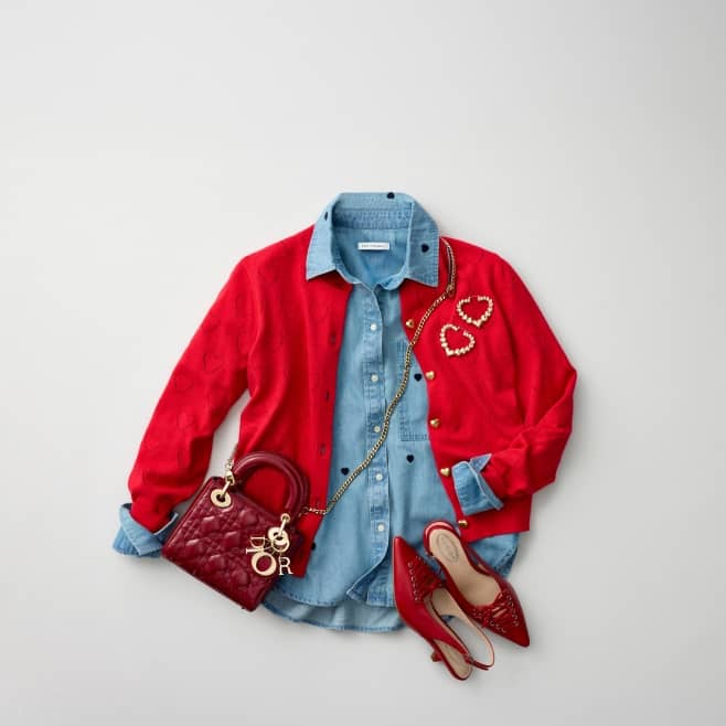 From five dollars. A red sweater, a denim shirt, heart-shaped earrings, red shoes and a Dior bag are layered on top of one another.