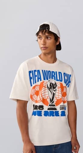 Image of man wearing a World Cup graphic t-shirt.