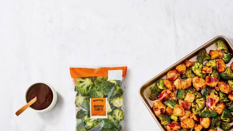 A bag of Marketside broccoli is shown, next to a sheet pan of broccoli, chicken and sweet potatoes.