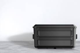 An image of a black toolbox on a grey background.