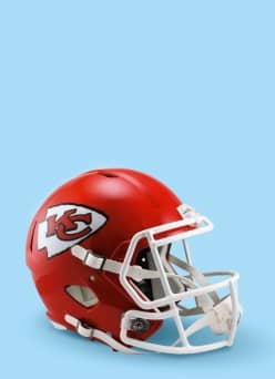 Image shows a red Kansas City Chiefs helmet memorabilia against a blue background.
