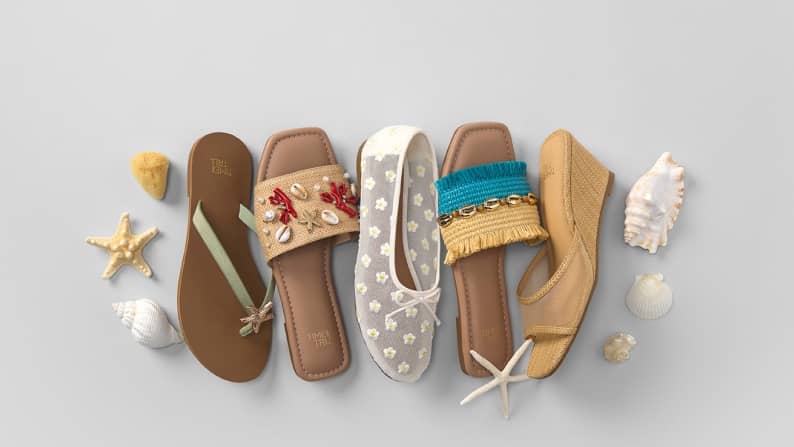 One white lace mesh ballet flat; one teal and yellow slide; one yellow wedge; one shell embellished flat; one thong sandal with star embellishment.