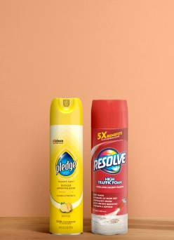 Furniture polish products on a wood surface.