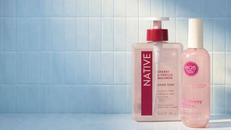 Hand soap and body wash in a bathroom setting.