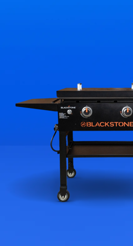 Image shows a black Blackstone outdoor griddle with two burners and a hard cover on a blue background.