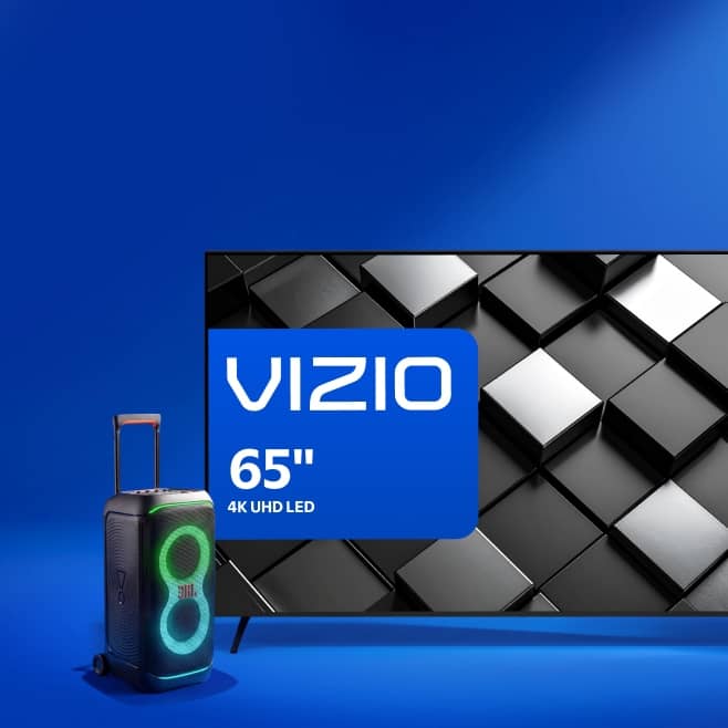 Vizio 65 inch 4K UHD LED TV with geometric cube pattern and a portable speaker with colorful lights beside it.