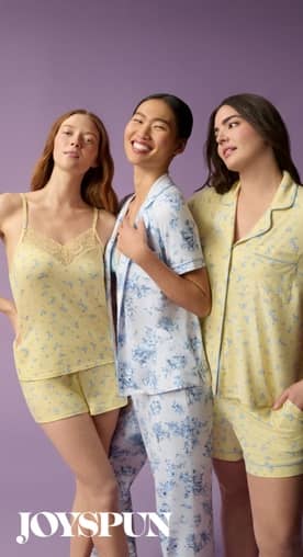 From Joyspun: Three women in pastel floral pajamas, including a yellow lace-trim cami set, a blue button-front set and a yellow short-sleeve set.