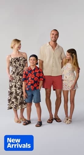 A family of four wearing new summer fashion, ranging from dresses, skirts, shorts, shirts and sandals.