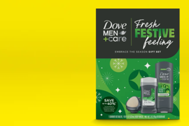Image shows a Dove Men+Care holiday gift set with green packaging on a yellow background.