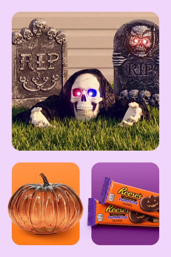 Novelty skeleton figure with glowing eyes displayed between two tombstones with skull details, decorative glass pumpkin, and candy bars.
