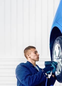 Mechanic changing a tire.