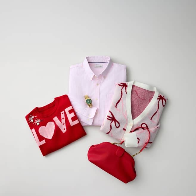 From six dollars. A red sweater, a pink shirt, a bow cardigan, a red purse, a gold watch and silver earrings are layered on top of one another.