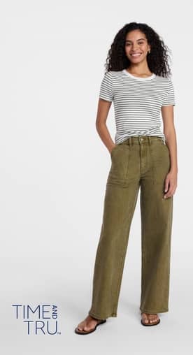 Time and Tru logo. A woman is wearing a striped t-shirt and green pants.